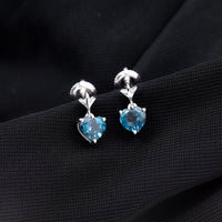 Four-carat London Blue Topaz heart drop earrings for women featuring elegant sterling silver settings by Rosec Jewels.