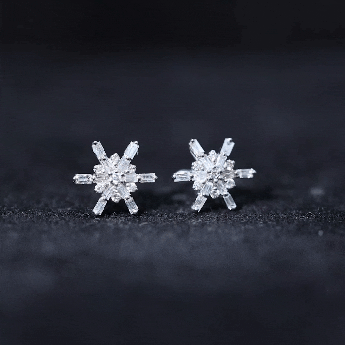 Rosec Jewels minimal diamond snowflake stud earrings featuring delicate white snowflake design and sparkling diamonds.