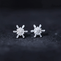 Yellow gold minimal diamond snowflake stud earrings by Rosec Jewels showcasing delicate snowflake design and sparkling diamonds.