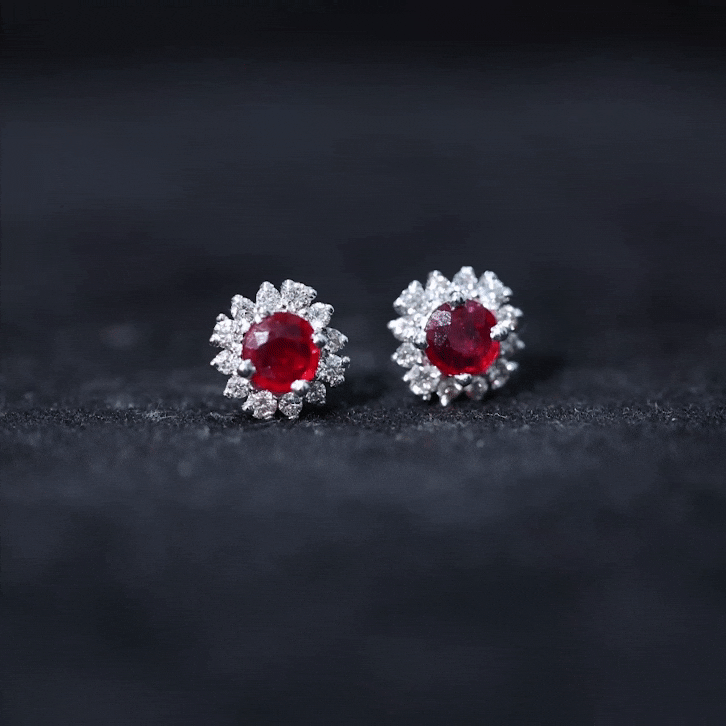Genuine ruby stud earrings with diamond halo from Rosec Jewels, featuring vibrant red rubies and sparkling diamond accents.