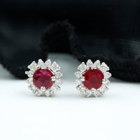 Genuine ruby stud earrings with diamond halo featuring Rosec Jewels, showcasing the sparkling ruby and elegant diamond accents.