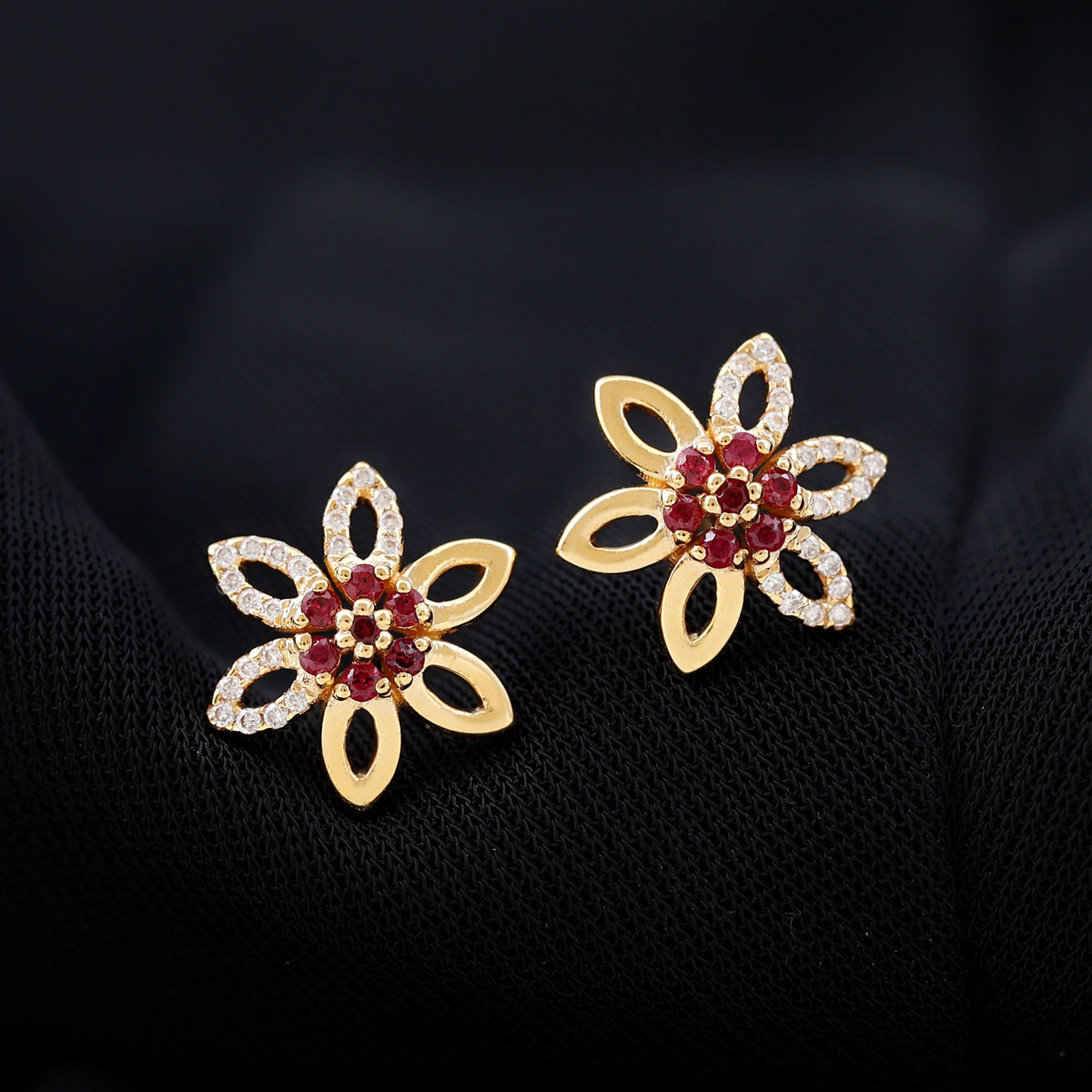 Natural ruby floral stud earrings with diamond accents from Rosec Jewels, featuring intricate flower design and sparkling gemstones.