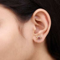 Natural Ruby floral stud earrings with diamond accents by Rosec Jewels, featuring intricate floral design and sparkling gemstone details.