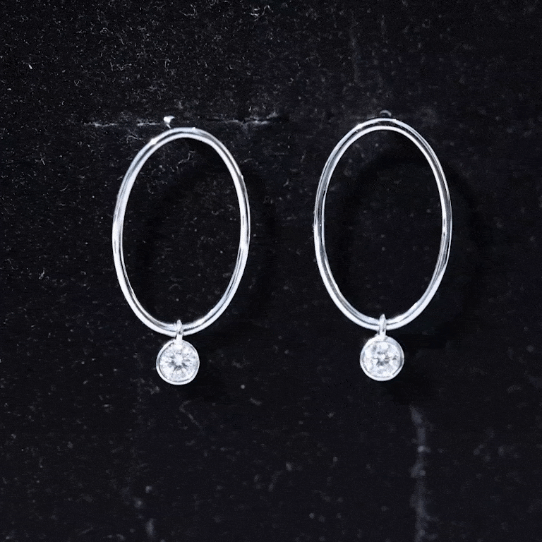 Yellow bezel set moissanite front-facing hoop drop earrings by Rosec Jewels with sparkling gemstone details.