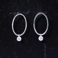 Yellow bezel set moissanite front-facing hoop drop earrings by Rosec Jewels with sparkling gemstone details.