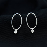 Bezel set moissanite front-facing hoop drop earrings by Rosec Jewels with sparkling stones and elegant design.