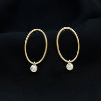 Rosec Jewels bezel set moissanite front-facing hoop drop earrings shown in a close-up image.