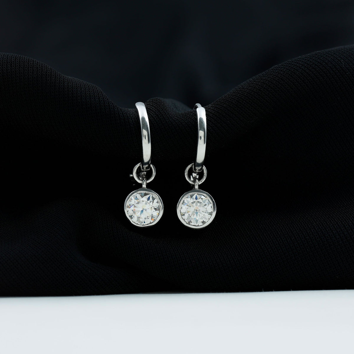 Bezel set moissanite hinged hoop earrings by Rosec Jewels showcasing sparkling gemstones and sleek gold design.