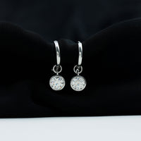 Bezel set 2 carat round moissanite drop hoop earrings by Rosec Jewels with sparkling gemstone details.
