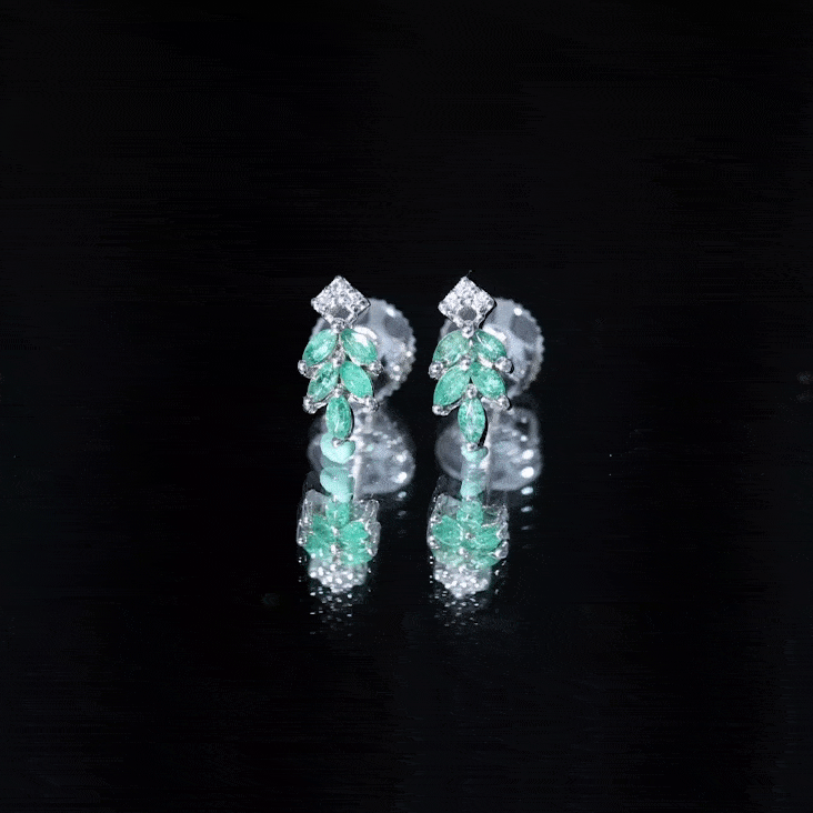 Yellow gold real emerald leaf stud earrings with sparkling moissanite accents from Rosec Jewels.