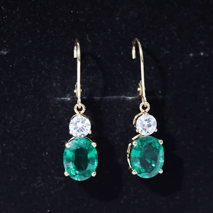 Certified 6 Carat Oval Cut Lab Grown Emerald Drop Hoop Earrings by Rosec Jewels, featuring elegant emerald gemstones and hoop design.