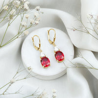 Oval Shape Lab Created Ruby Dangle Drop Earrings with Moissanite