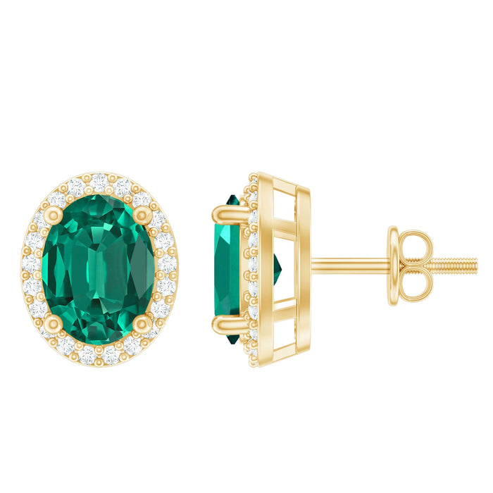 Oval-shaped lab grown emerald and diamond halo stud earrings by Rosec Jewels, featuring classic elegant design.