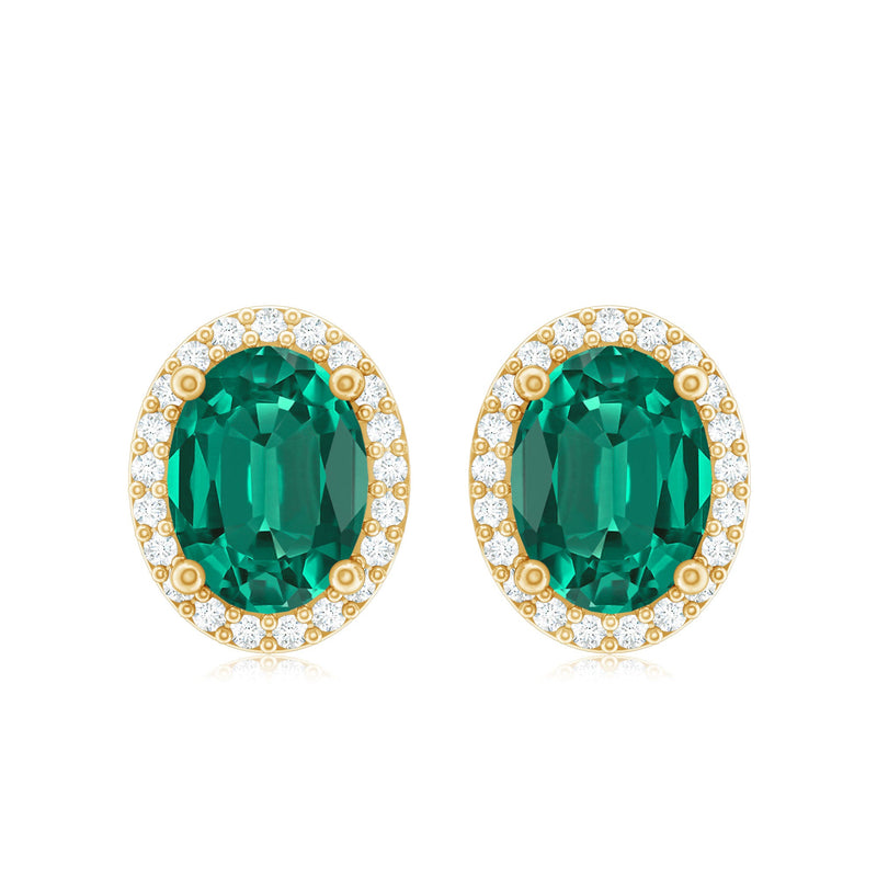 Oval lab-grown emerald and diamond halo stud earrings by Rosec Jewels featuring elegant gemstone and sparkling diamond accents.