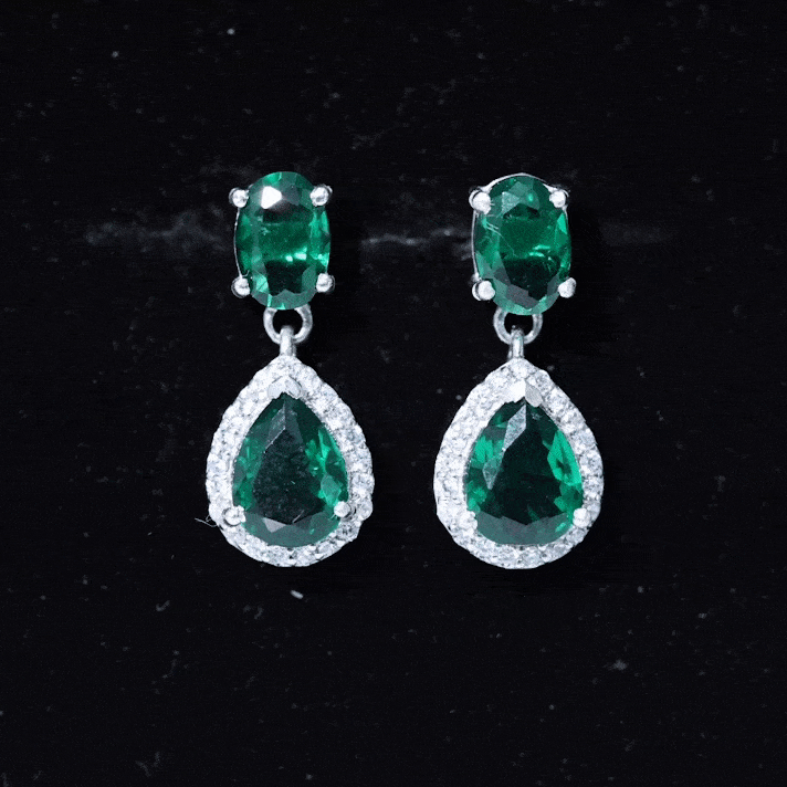 Lab created emerald dangle earrings with sparkling moissanite stones by Rosec Jewels, featuring elegant yellow accents.