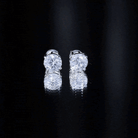 Certified 4 Carat Moissanite stud earrings in silver with four sparkling stones, showcasing elegant jewelry design.