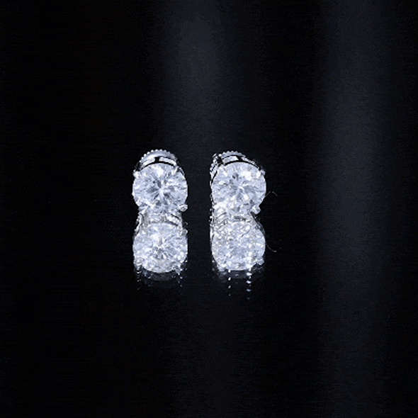 Certified 4 Carat Moissanite stud earrings in silver with four sparkling stones, showcasing elegant jewelry design.