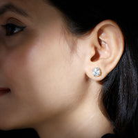 Certified 4 Carat Moissanite stud earrings in silver with round gemstones, featuring a classic and elegant design from Rosec Jewels.