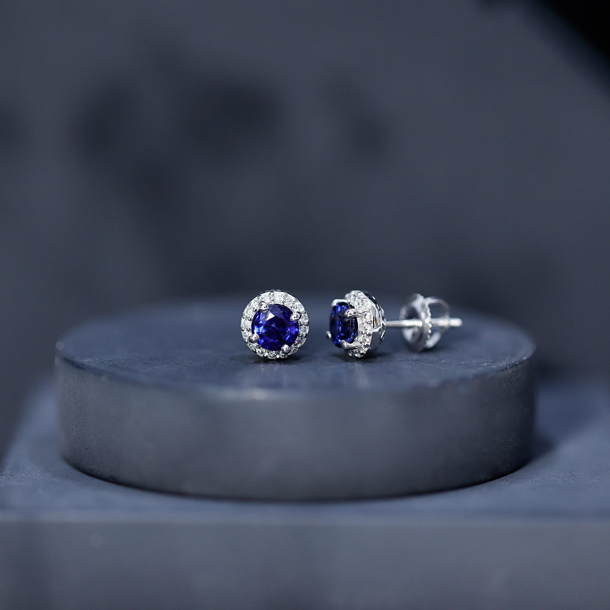 Real 1.9 carat blue sapphire and diamond halo stud earrings by Rosec Jewels, featuring a sparkling gemstone design.