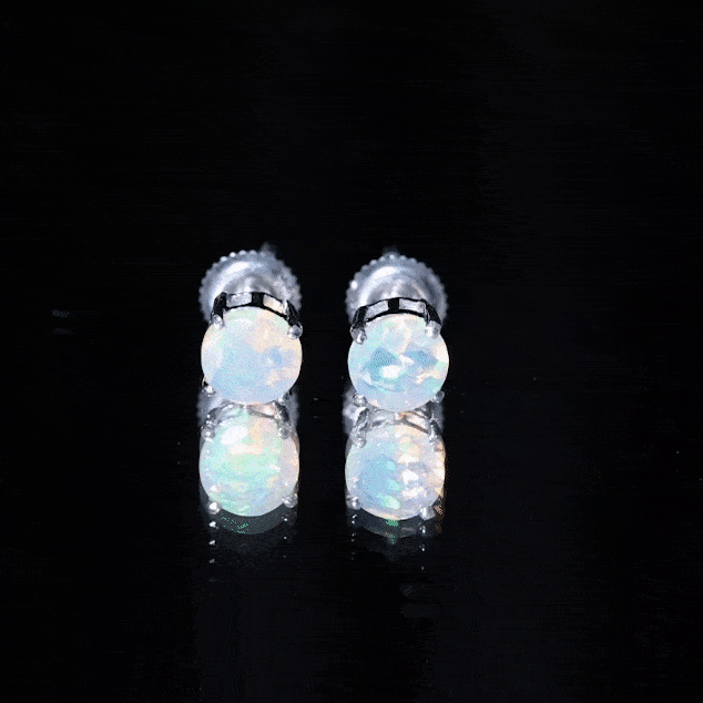 Ethiopian opal solitaire stud earrings in silver with 1.6 carats, featuring a stunning white opal gemstone.