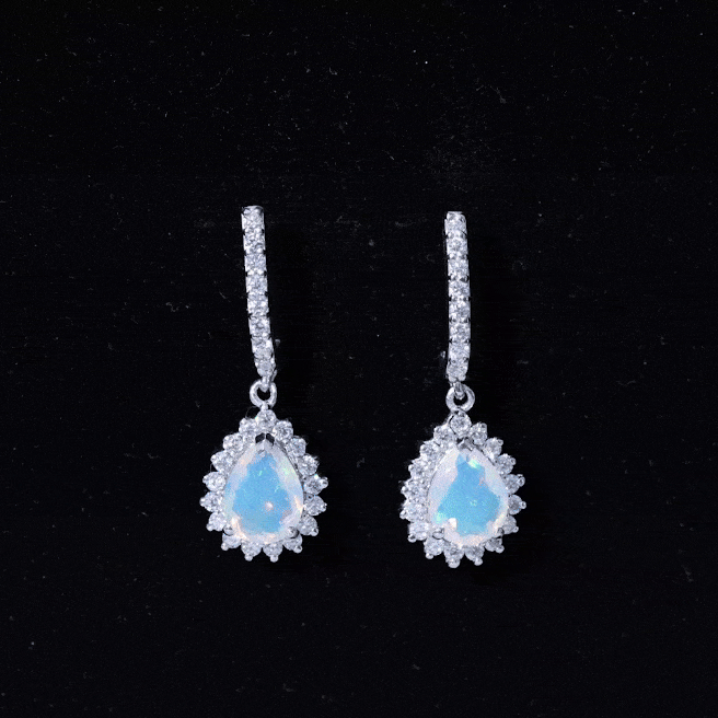 Ethiopian opal teardrop earrings with moissanite halo, featuring 1.4 carats, set in silver, from Rosec Jewels.