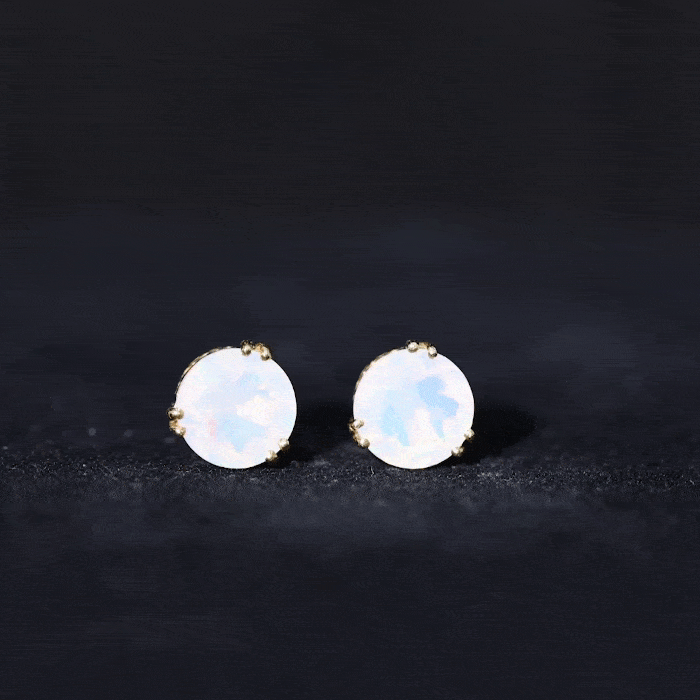 Ethiopian opal solitaire stud earrings in double prong setting by Rosec Jewels, showcasing vibrant 4-carat opal gemstones.