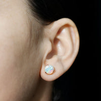 Ethiopian Opal solitaire stud earrings in double prong setting by Rosec Jewels, showcasing vibrant 4-carat opal gemstones.