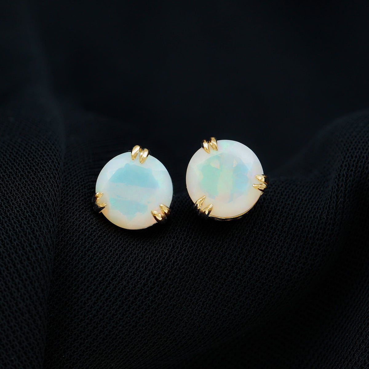 Ethiopian opal solitaire stud earrings in double prong setting by Rosec Jewels, showcasing vibrant 4-carat opal gemstones.