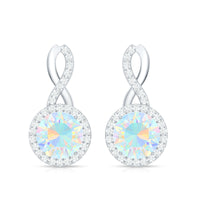Ethiopian opal and diamond infinity stud earrings by Rosec Jewels featuring 1 carat opal stones and sparkling diamonds.
