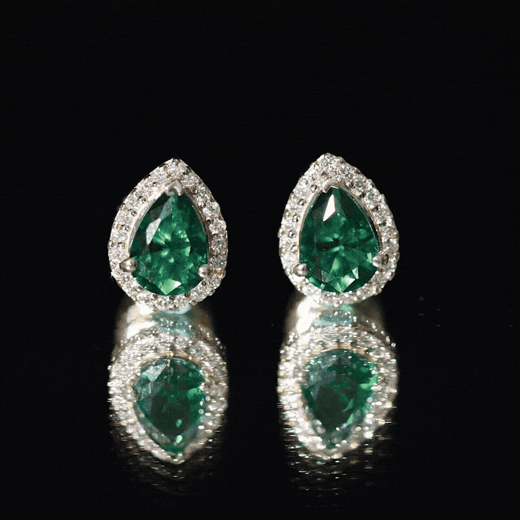 Yellow lab-created emerald teardrop stud earrings with diamond halo by Rosec Jewels, showcasing elegant gemstone and sparkling accents.