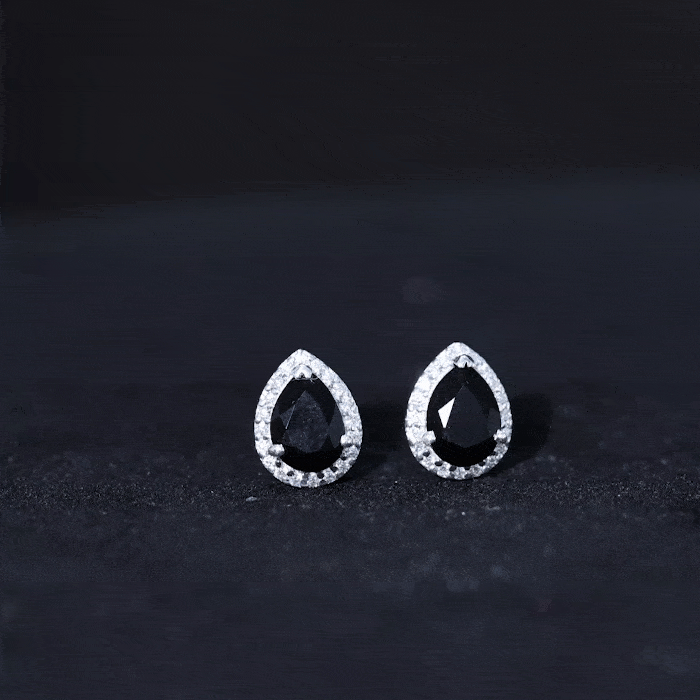 Pear-shaped black onyx and diamond halo stud earrings by Rosec Jewels, showcasing elegant jewelry design with sparkling accents.