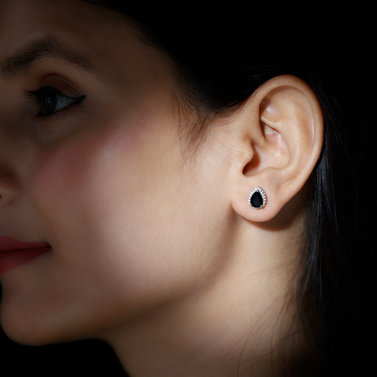 Pear-shaped black onyx and diamond halo stud earrings by Rosec Jewels, showcasing elegant black gemstone and sparkling diamond accents.