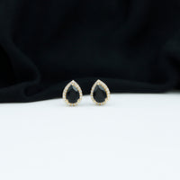 Pear cut black onyx and diamond halo stud earrings by Rosec Jewels, featuring elegant gemstone and sparkle details.