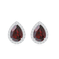 Natural 5x7mm garnet teardrop stud earrings with diamond halo from Rosec Jewels, showcasing sparkling gemstones and elegant design.