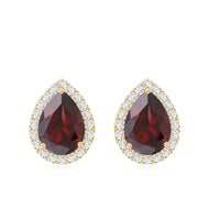 Natural 5x7mm garnet teardrop stud earrings with diamond halo from Rosec Jewels, showcasing the elegant gemstone design.