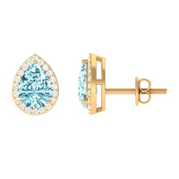 Pear-shaped aquamarine stud earrings with diamond halo from Rosec Jewels, showcasing elegant blue gemstones and sparkling diamond accents.