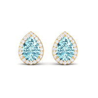 Pear-shaped aquamarine stud earrings with diamond halo from Rosec Jewels, showcasing elegant blue gemstones and sparkling accents.