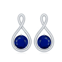 Blue sapphire solitaire infinity stud earrings with 3/4 carat round cut stones by Rosec Jewels displayed on white background.