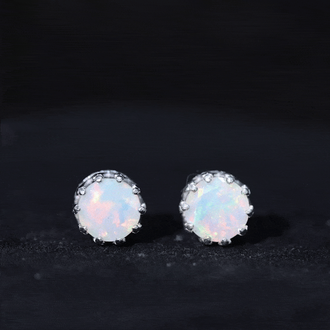 Rosec Jewels Ethiopian Opal crown stud earrings featuring vibrant opal gemstones and secure gold settings.