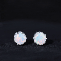 Rosec Jewels Ethiopian Opal crown stud earrings featuring vibrant opal gemstones and secure gold settings.