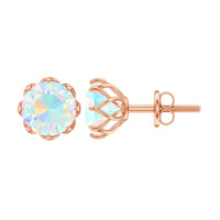 Ethiopian Opal solitaire stud earrings with 6mm gemstones set in gold, featuring elegant and simple jewelry design.