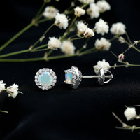 Natural Ethiopian Opal and Moissanite halo stud earrings by Rosec Jewels, featuring sparkling gemstone accents and a classic earring design.