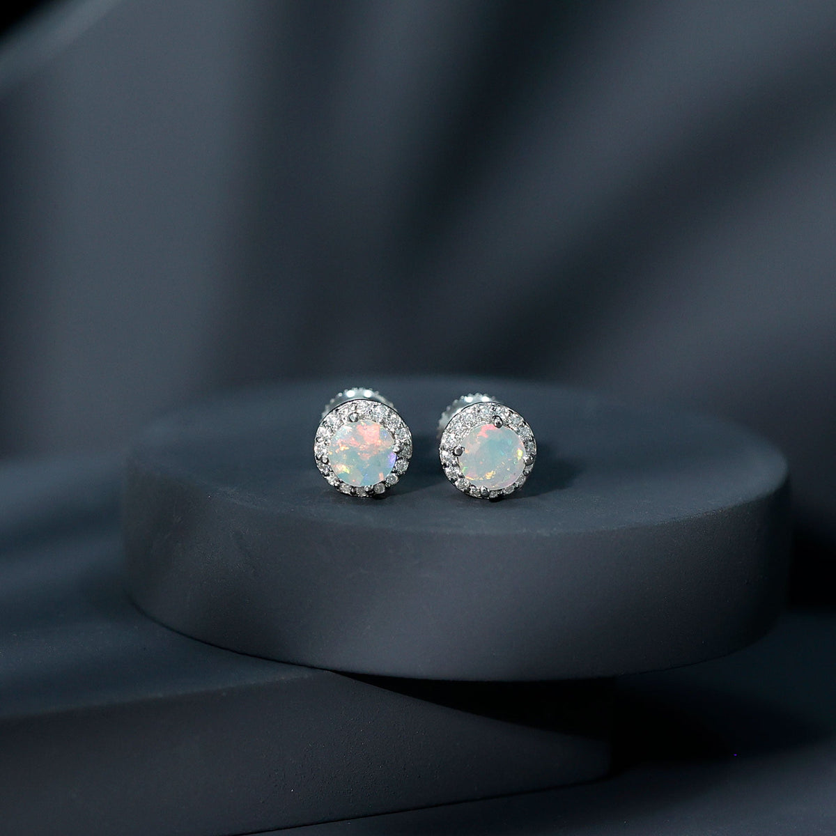 Natural Ethiopian Opal and Moissanite halo stud earrings featuring sparkling gemstones set in elegant earrings design.
