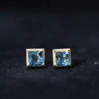 Pair of 2 Carat Princess Cut London Blue Topaz stud earrings by Rosec Jewels, showcasing sparkling blue gemstones on a white background.