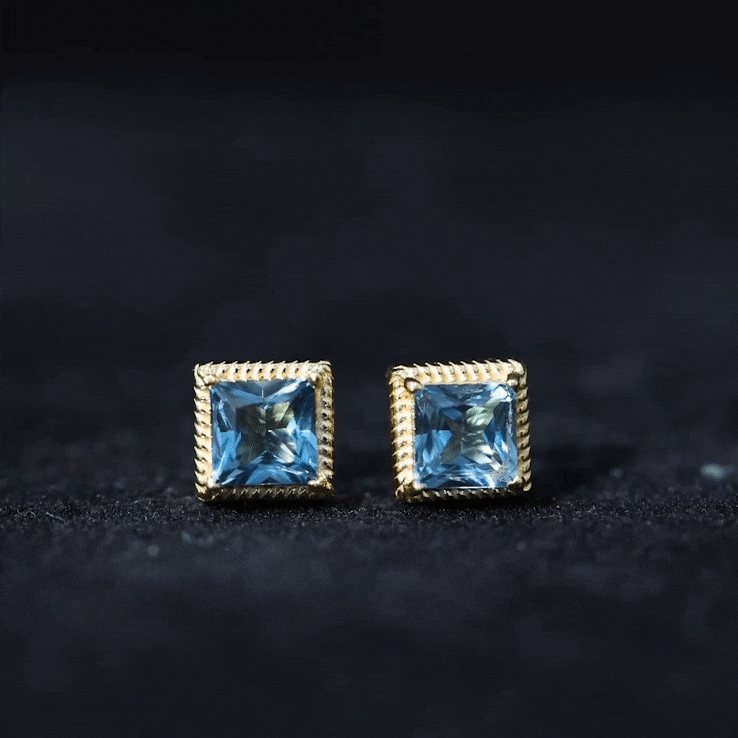 Yellow gold stud earrings featuring 2 carat princess cut London Blue Topaz gemstones by Rosec Jewels.