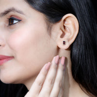 Emerald cut garnet solitaire stud earrings in bezel setting by Rosec Jewels featuring 1.4 CT gemstones and elegant design