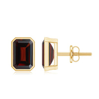 Emerald cut garnet solitaire stud earrings in bezel setting by Rosec Jewels, showcasing deep red gemstone in elegant jewelry design.