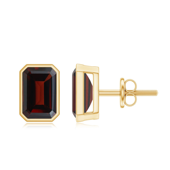 Emerald cut garnet solitaire stud earrings in bezel setting by Rosec Jewels, showcasing deep red gemstone in elegant jewelry design.
