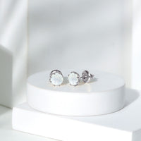 Rosec Jewels 6mm moonstone solitaire stud earrings, elegant jewelry with sparkling moonstones and silver settings.