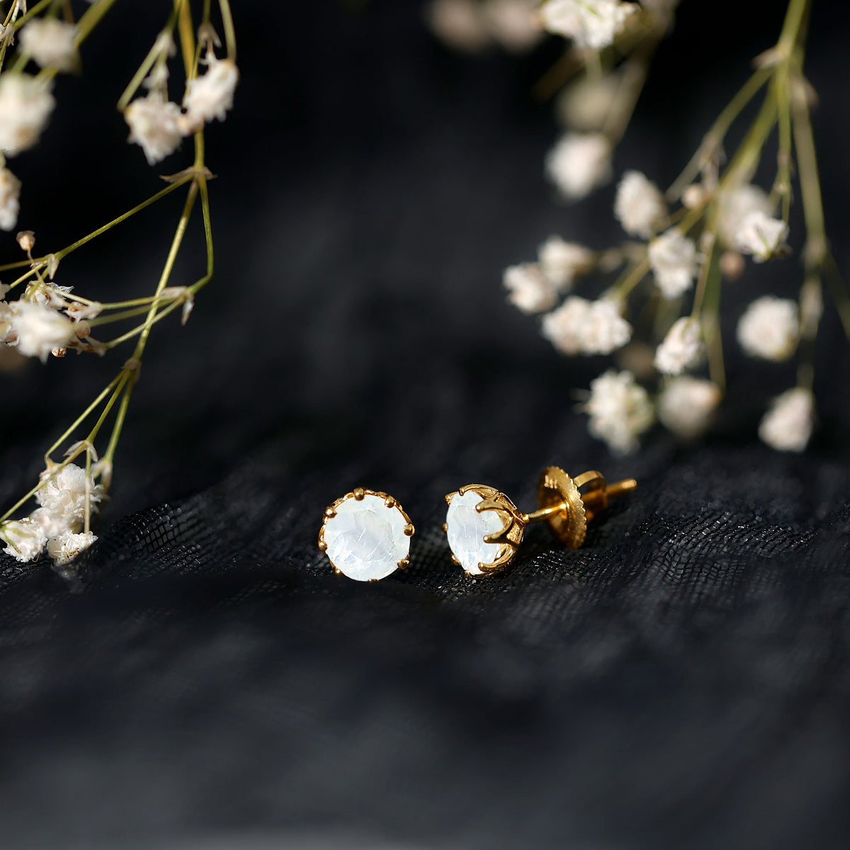 Rosec Jewels 6mm moonstone solitaire stud earrings featuring elegant decorative design and polished silver setting.